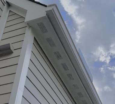 View from below looking up at soffits installed on a house